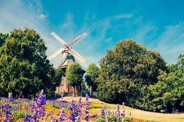 Herdentorsmühle. Windmill in the ramparts, wall of the city of Bremen. Old windmill in a public...