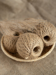 Tangles of jute twine threads in basket. Natural. Yarn for needlework. Vertical