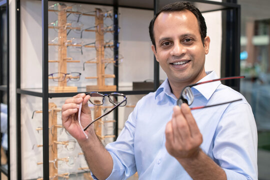 Indian Businessman Tries On And Chooses Glasses In Optical Store, Choose Which One You Like, Both Of Them