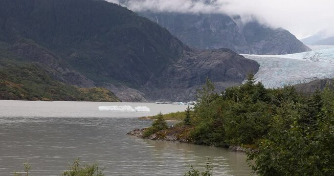 Mendenhall Glacier Juneau Alaska pan. Climate change global warming result is rapidly retreating, shrinking, and melting.