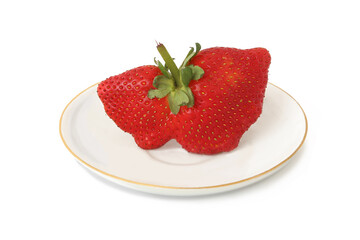 Big strawberry in a saucer