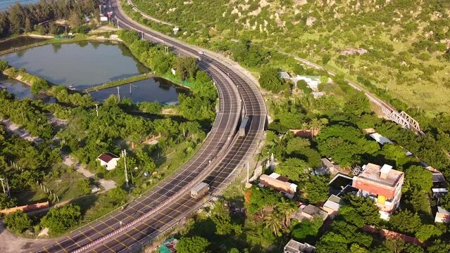 Main coastal highway road Ah 1 in Vietnam leading through rural green vibrant landscape