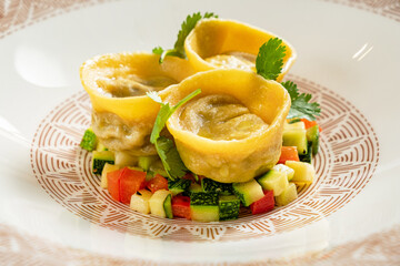 italian ravioli with vegetables and sauce
