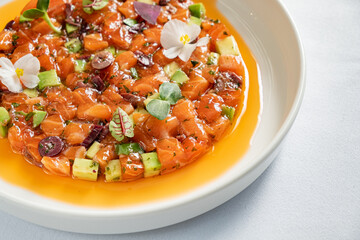 salmon tartar with avocado and herbs