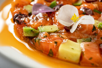 salmon tartar with avocado and herbs