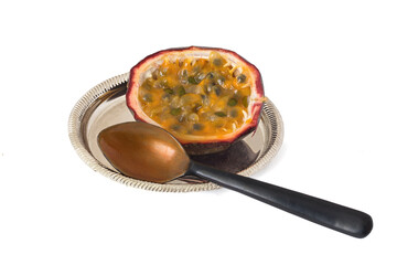 Cut passiflora on plate isolated on white