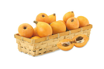 Loquat  in wicker basket isolated on white