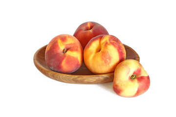 Naklejka na ściany i meble Tasty peaches in wood bowl isolated on white
