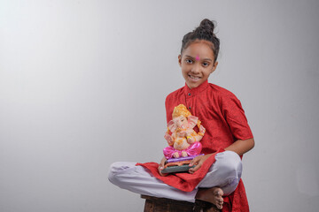 Little Indian child with lord ganesha