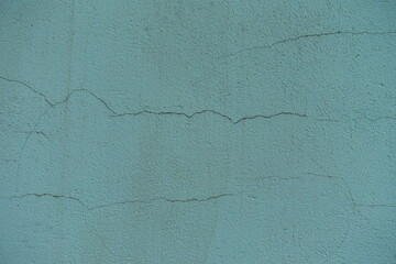 Background - old mint colored painted wall with cracks