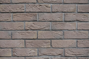 Close up of dark chocolate brown brick wall