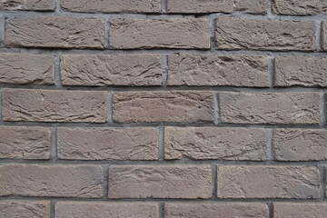 Close view of dark chocolate brown brick wall