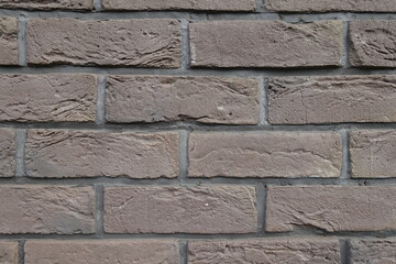 Detail of dark chocolate brown brick wall