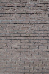 Surface of dark chocolate brown brick wall