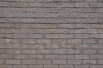Texture of dark chocolate brown brick wall