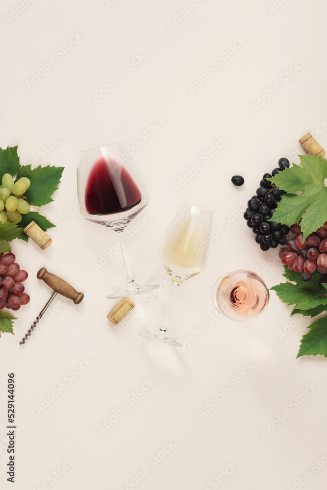 Canvas Prints Flat-lay of red, rose and white wine in glasses on pink background