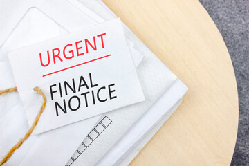 Writing note with words URGENT FINAL NOTICE on business mail envelopes.Late Payments.