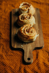 French cookies on desk on brown tablecloth