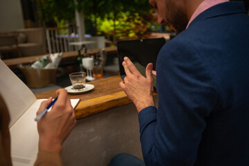 A businessman is checking his phone
