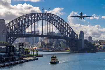 Fototapeta na wymiar Plane flying over Sydney Harbour Sydney NSW Australia. 