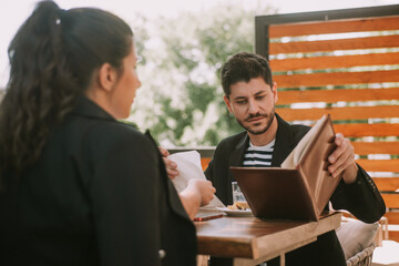 Business partners looking at notes
