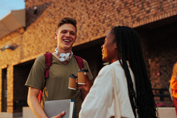 Friends talking after classes at college.