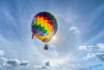 The hot air balloon festival in Ta Pa field after the harvest attracts people to attend and watch. This is the national day celebration in An Giang, Vietnam