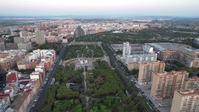 Aerial drone view of sunrise over Turia Gardens, a riverbed turned into a park, in Valencia, Spain