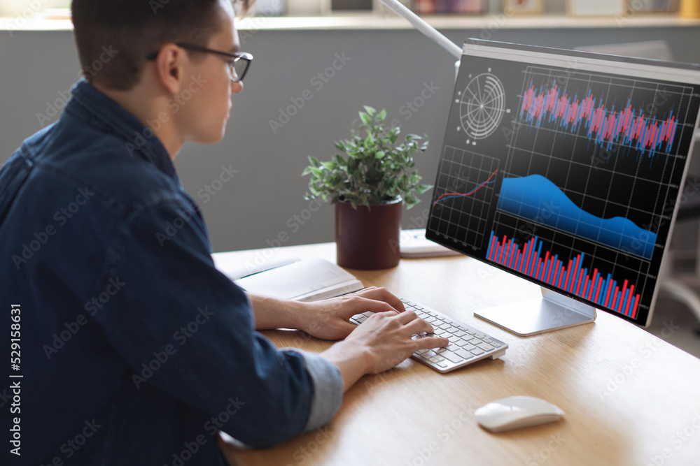 Aufkleber Millennial Businessman Analyzing Financial Statistics On Computer Screen While Working In Office