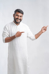 Senior man doing salutation wearing Kurta pajamas on the occasion of Independence day India