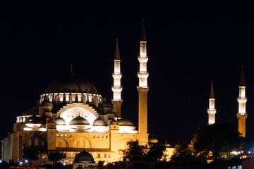 Fototapeta na wymiar Suleiman Mosque at night with lights on in Istanbul, Turkey
