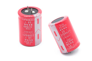 Electrolytic capacitor isolated on white background. In two perspectives.