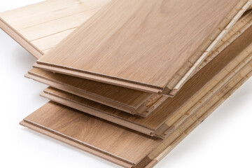 Oak engineered wood flooring boards in stack, fragment close-up