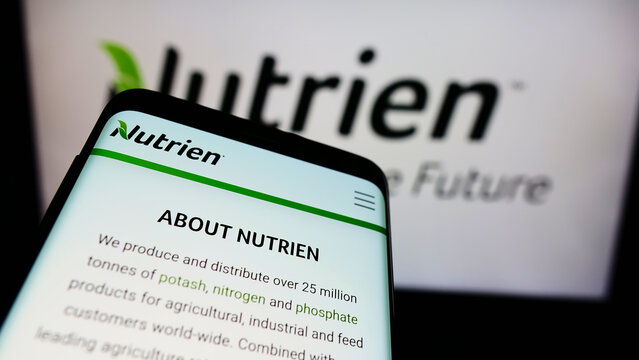 Stuttgart, Germany - 12-12-2021: Mobile phone with website of Canadian fertilizer company Nutrien Ltd. on screen in front of business logo. Focus on top-left of phone display.