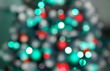 Christmas and New Year tree close up with unfocuse baubles and lights red and blue colors