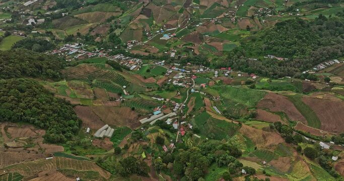 Cerro Punta Panama Aerial v2 birds eye view capturing beautiful landscape of cultivated farmland and indigenous homes located in high altitude mountainous area - Shot with Mavic 3 Cine - April 2022