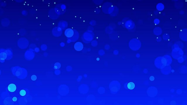 Blue animated background with light particles on the screen. Lens focus on blue background animation for christmas. Light blue particles falling shining on the screen