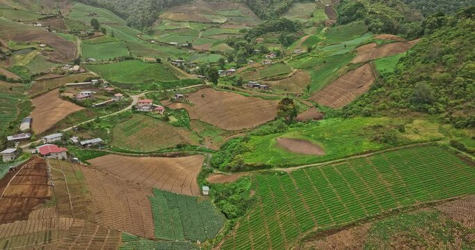 Cerro Punta Panama Aerial v4 cinematic drone flyover rural hillside area capturing beautiful high altitude farmland and foothill village with indigenous homes - Shot with Mavic 3 Cine - April 2022