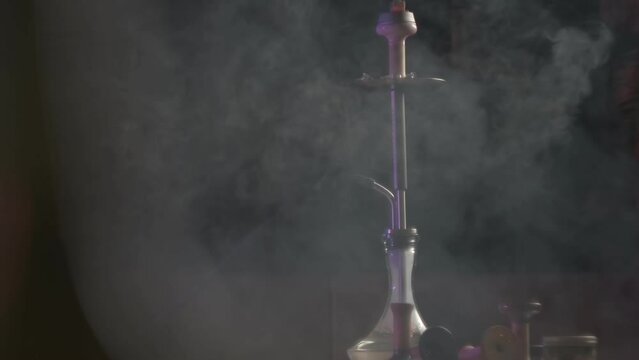 Smoke is swirling around the hookah