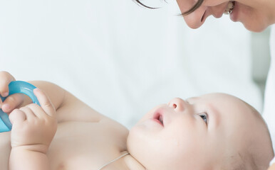 Portrait of a mother with her 6 months old baby, top view point