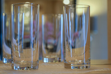 Entry hallway corridor living room of suite stateroom cabin with mirror, lights, cupboards, armchairs and flower decoration onboard ocean liner cruiseship cruise ship