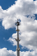 White Rostral Column on Admiralteyskaya Embankment in Voronezh. Close-up of top of column of in honor of 300th anniversary of Russian Navy.  Voronezh, Russia - July 30, 2022