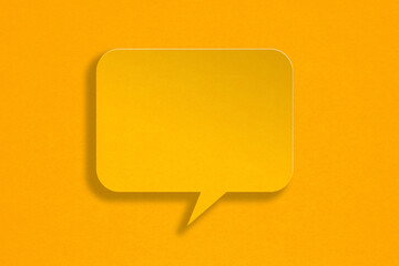 blank yellow speech bubble grunge  paper cut, on grunge yellow paper background. Conceptual image about communication and social media