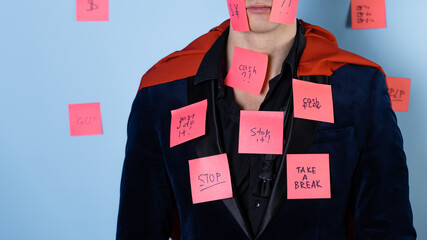 Even superheroes experience professional burnout. A man in the image of a hero in a business suit...