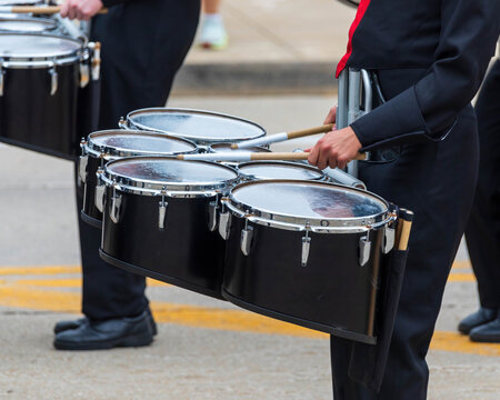 one snare drum of a marching band drum line warming up for a parade