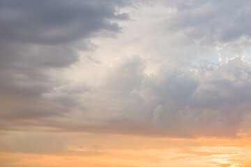 Naklejka na ściany i meble Stormy clouds during sunset.