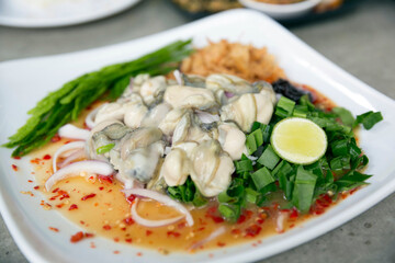 Spicy Oyster Salad, Thai food selected focus image
