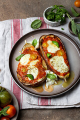 Baked eggplant with mozzarella cheese, tomatoes and basil