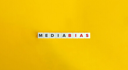 Media Bias Phrase on Block Letter Tiles on Yellow Background. Minimal Aesthetics.