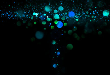 green and blue circles on a dark background. Beautiful abstract background